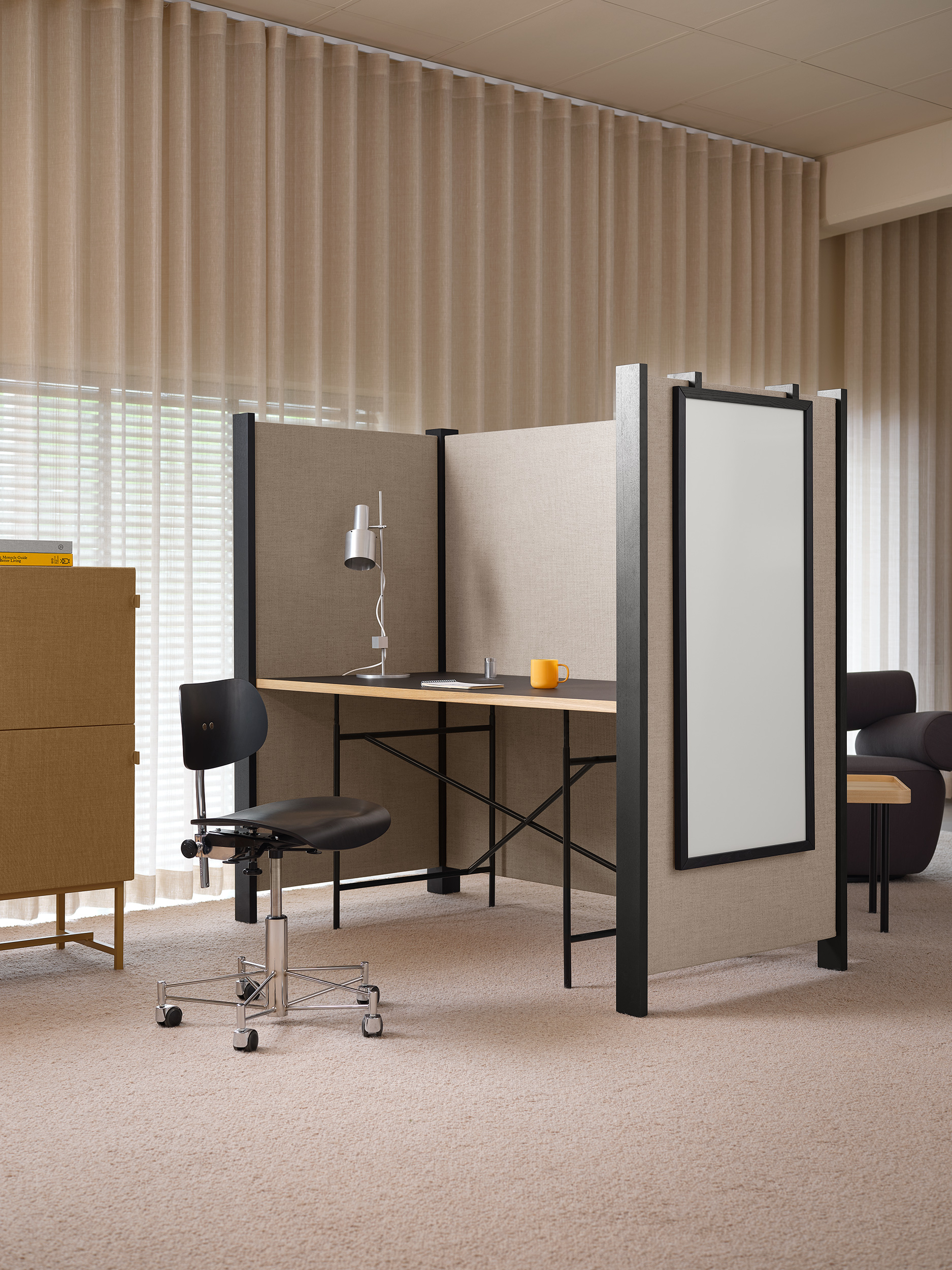 Desk in sound absorbing cubicle.